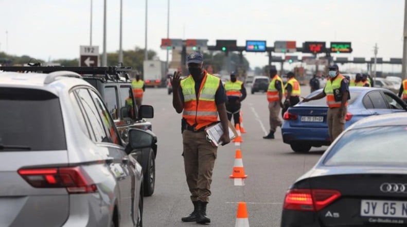 Traffic officers at a toll booth in South Africa
