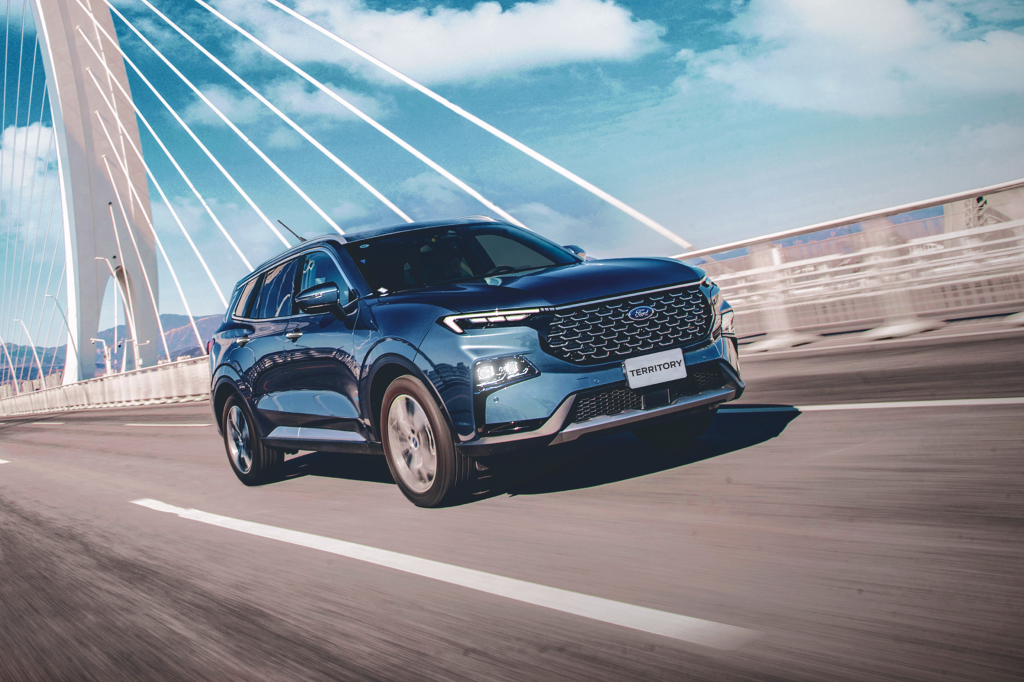The all new Ford Territory driving on a bridge