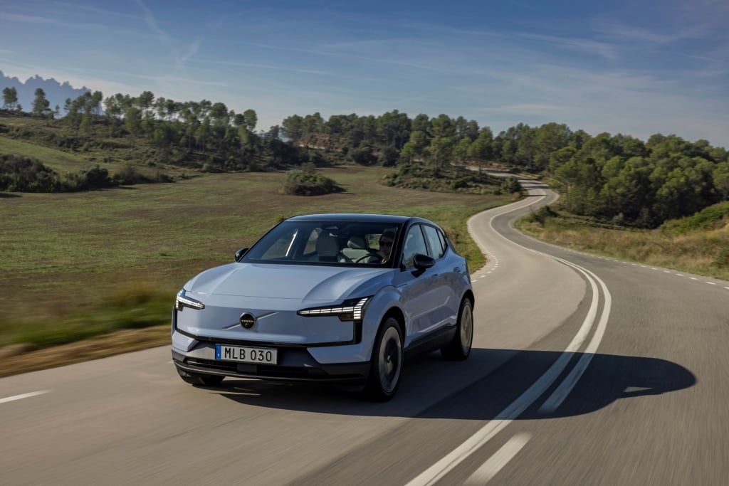 Volvo EX30 driving fast on a open road