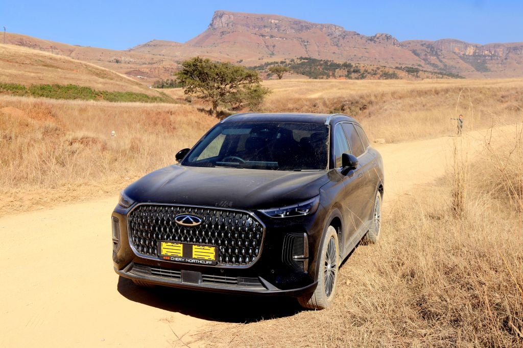 The Drakensberg mountains provide a backdrop to the dusty Tiggo 9