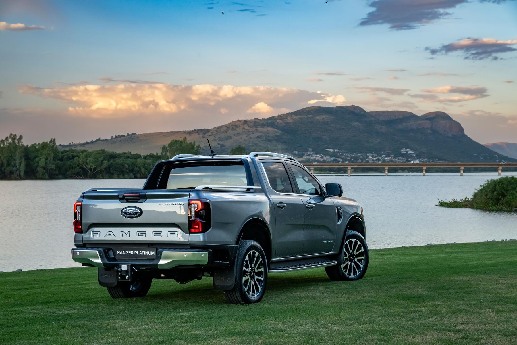 A silver Ford Ranger Platinum next othe Hartebesspoort dam