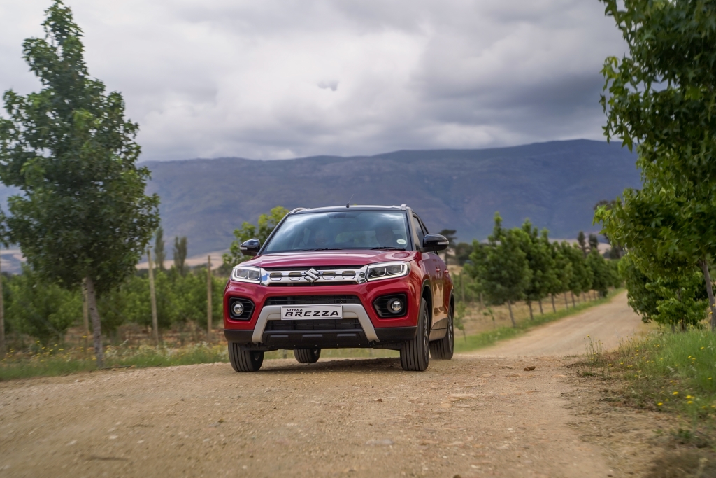 Red Suzuki Vitara Brezza in the Cape winelands