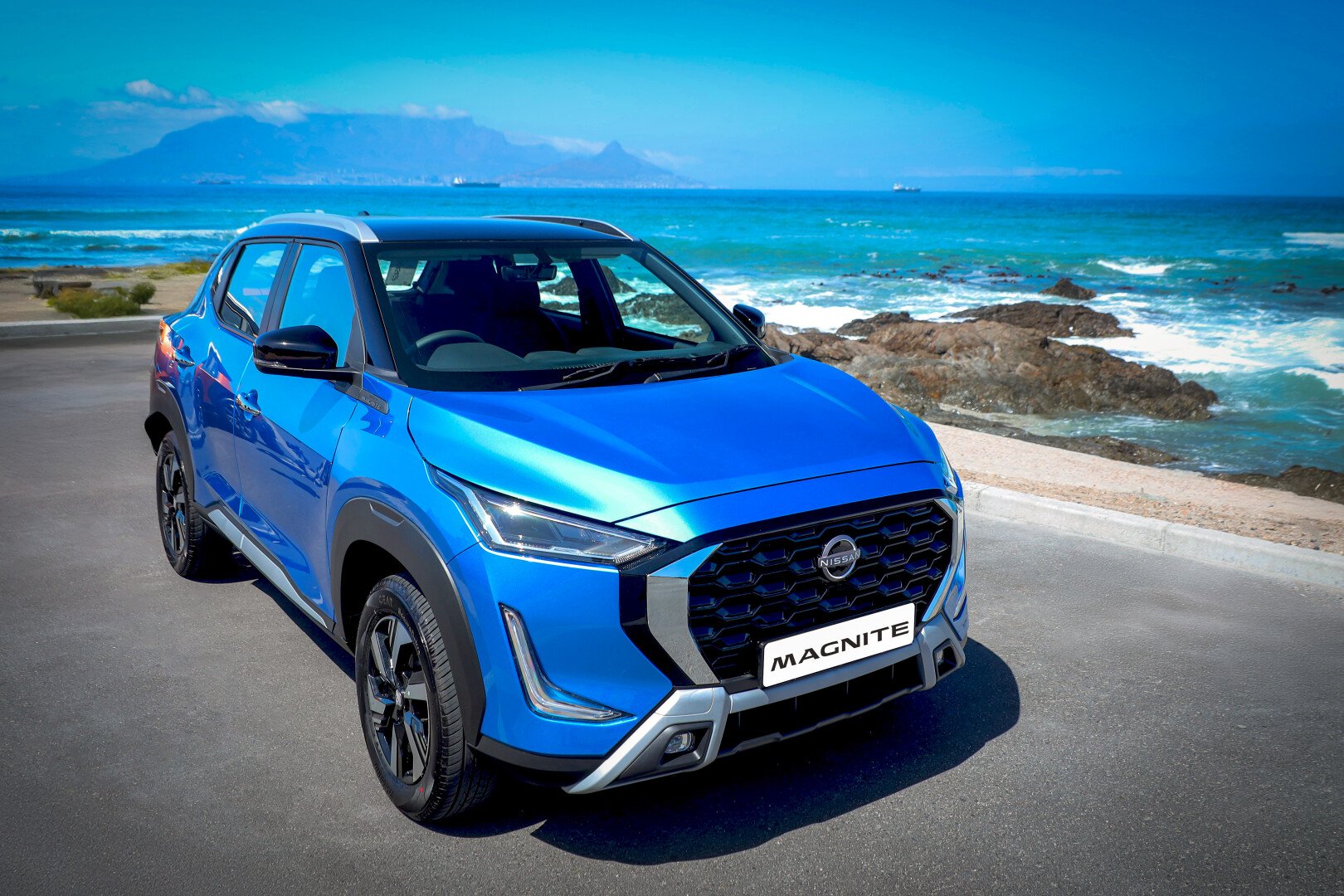 Nissan Magnite with ocean backdrop